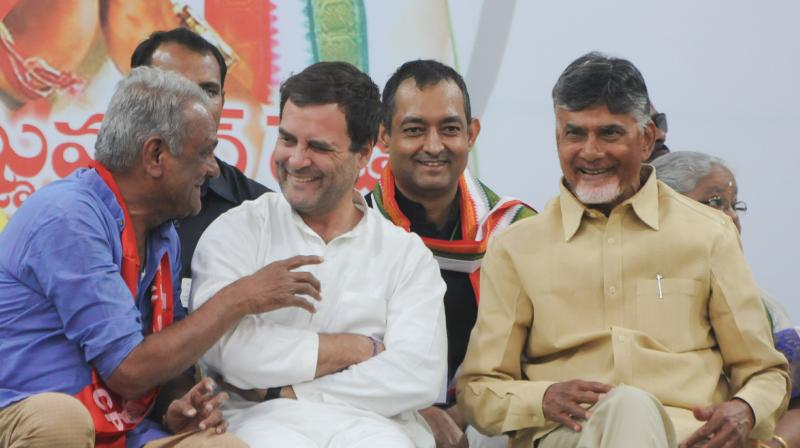 CPIs Narayan shares a lighter moment with Congress chief Rahul Gandhi and AP Chief Minister N. Chandrababu Naidu during a public meeting at Rahmatnagar on Monday.  (Deepak Deshpande)