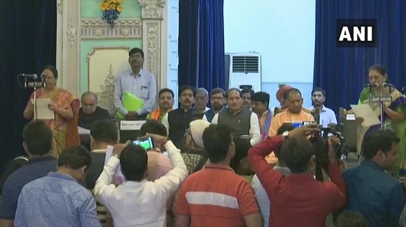 3 MLAs take oath as ministers in Uttar Pradesh Government, 6 of them as Cabinet Ministers, in the first Cabinet reshuffle of the present Government. (Photo: Twitter | @ANINewsUP)