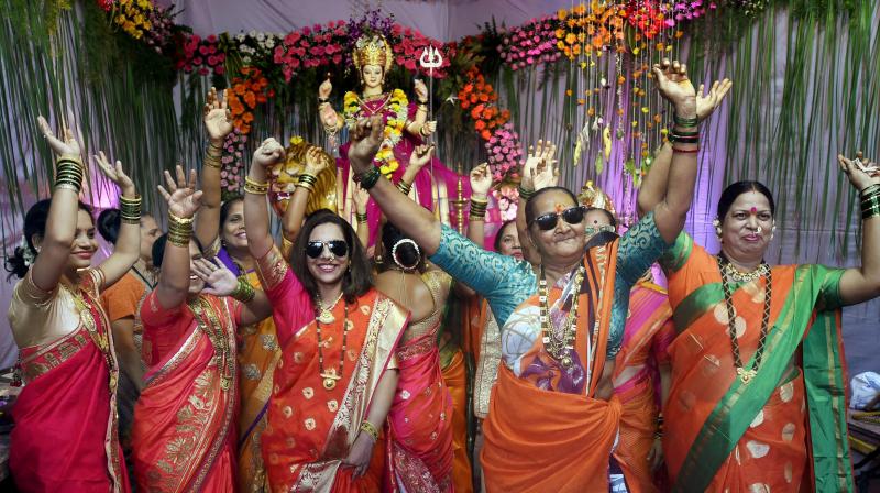 Women dance on the occasion of Lalita Panchami during Navratri celebrations at a pandal, in Mumbai (Photo: PTI)