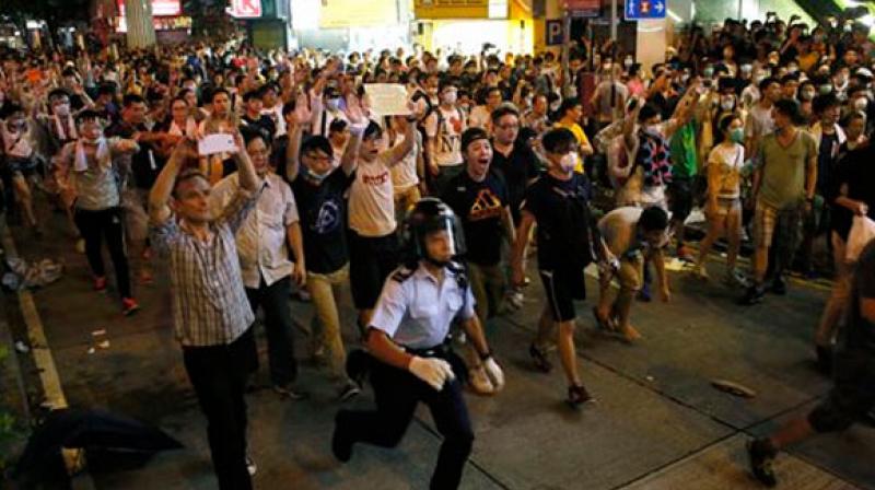 Hong Kong protesters end police headquarters siege peacefully after demands unmet