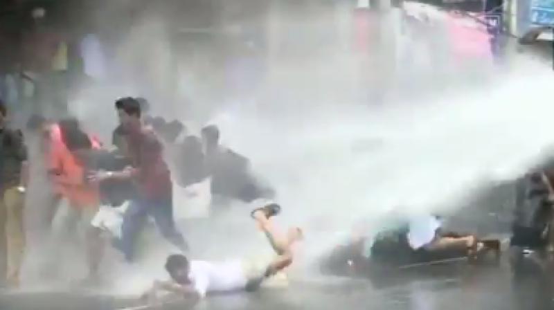 Kerala police on Sunday used high power water cannon to disperse protestors of National youth fronts like Akhil Bhartiya Vidyarthi Parishad (ABVP) and Bhartiya Janata Yuva Morcha (BJYM). (Photo: Twitter I ANI).