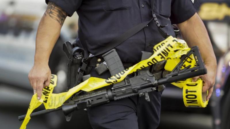 The officer was driving down the road and was ambushed by an individual who pointed a gun at him from inside of his car and shot out the police officers window, police said. (Photo: Representational Image)