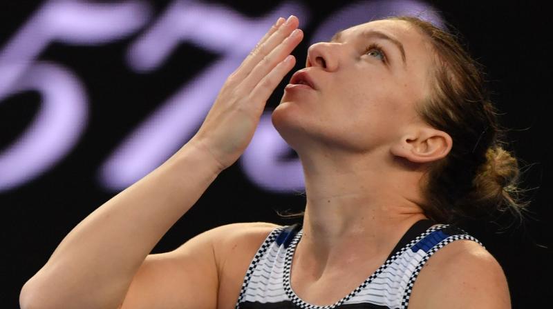 Simona Halep celebrates after victory over Venus Williams during their womens singles match on day six of the Australian Open. (Photo: AFP)