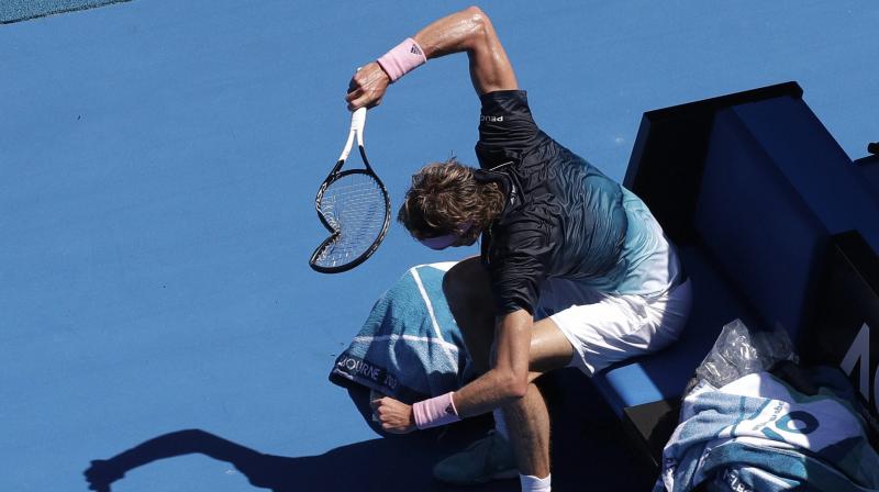 Alexander Zverev smashes his racket in frustration during his fourth round match against Milos Raonic at the Australian Open. (Photo: PTI)