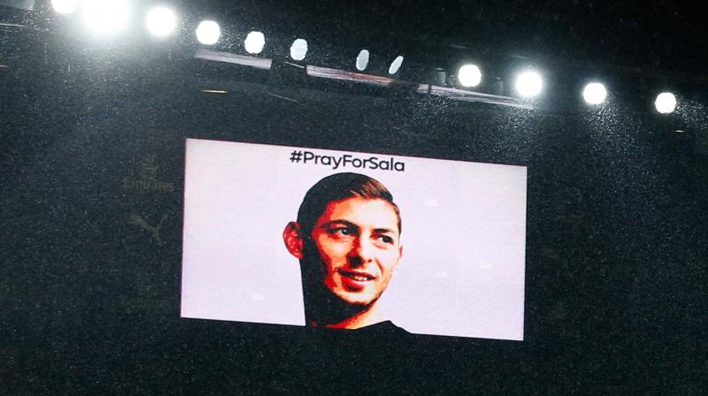The big screen shows the face of Emiliano Sala during a moments silence in his honour ahead of the match between Arsenal and Cardiff City. (Photo: AFP)