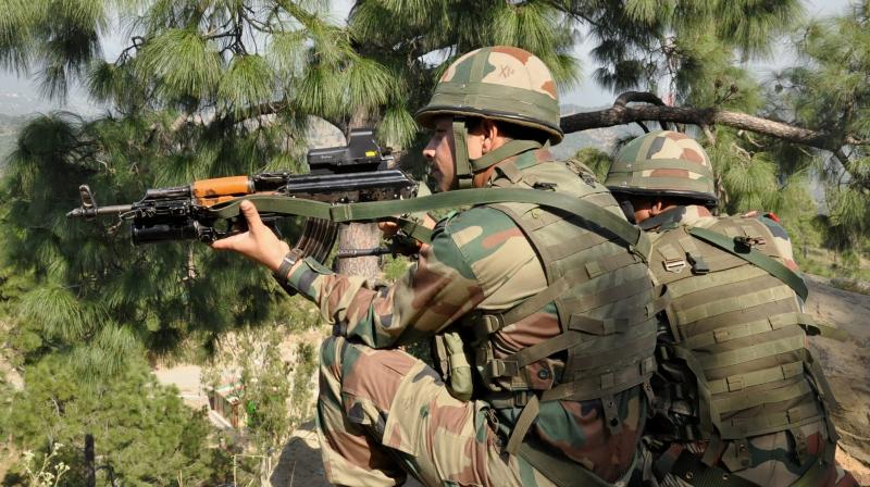 Indian army soldiers take positions near the Line of Control in Nowshera sector of Rajouri near Jammu. (Photo: PTI)