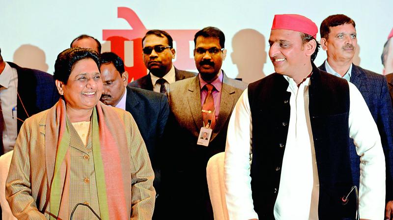 BSP leader Mayawati, left, and SP chief Akhilesh Yadav in Lucknow, Saturday. (Photo: AP)