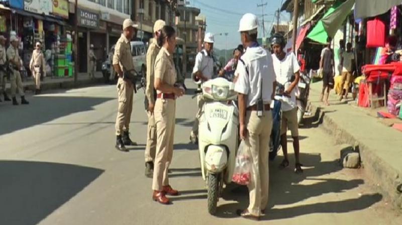 Manipur cops give sweets to people riding without helmet