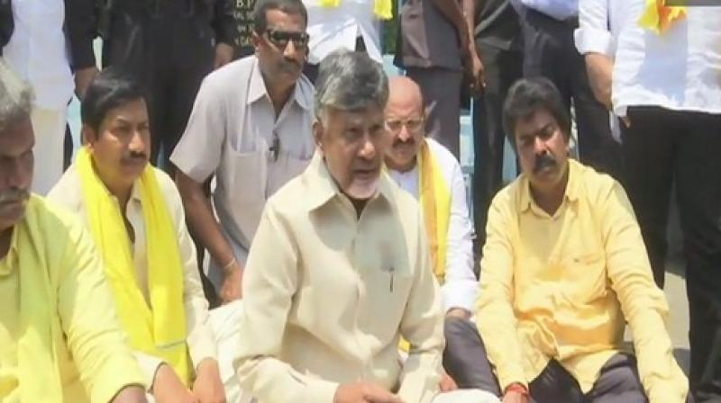AP CM stages protest against I-T raids on TDP candidates; slams PM