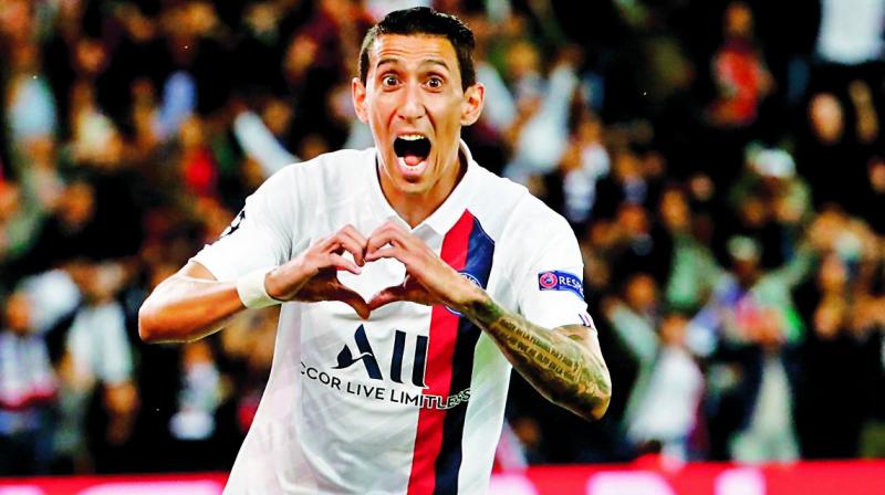 Paris Saint-Germains Angel di Maria celebrates after scoring against Real Madrid in their Champions League Group A match in Paris on Wednesday. (Photo: AFP)