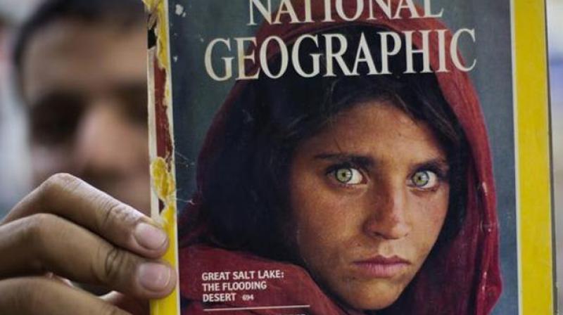 Sharbat Gulla gained international fame in 1984 as an Afghan refugee girl, after war photographer Steve McCurrys photograph of her, with piercing green eyes, was published on National Geographics cover. (Photo: AP)