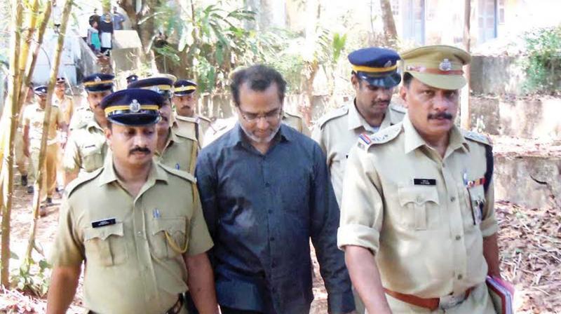 Police takes Robin Vadakkumchery into custody after the court verdict in Thalasserry on Thursday.