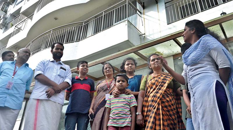 Child Welfare Committee (CWC) team led by vice-president K.S. Arunkumar listens to the woes of children in H2O Holy Faith apartments, which the Supreme Court had ordered to be demolished in Kochi on Friday.  (SUNOJ NINAN MATHEW)