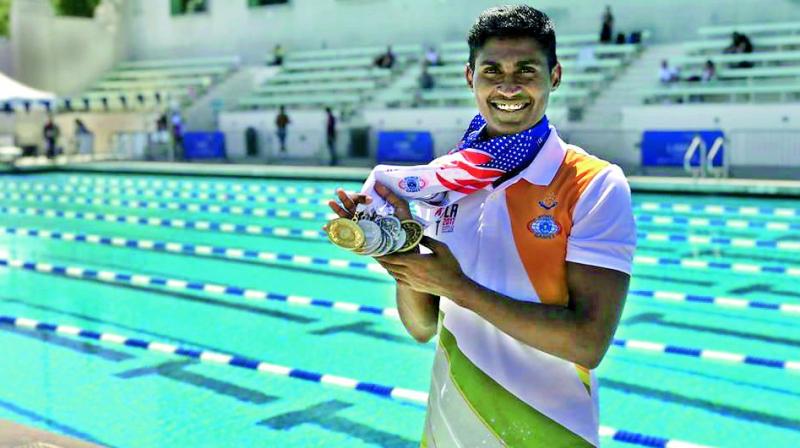 Tulasi Chaitanya with his winning medals.
