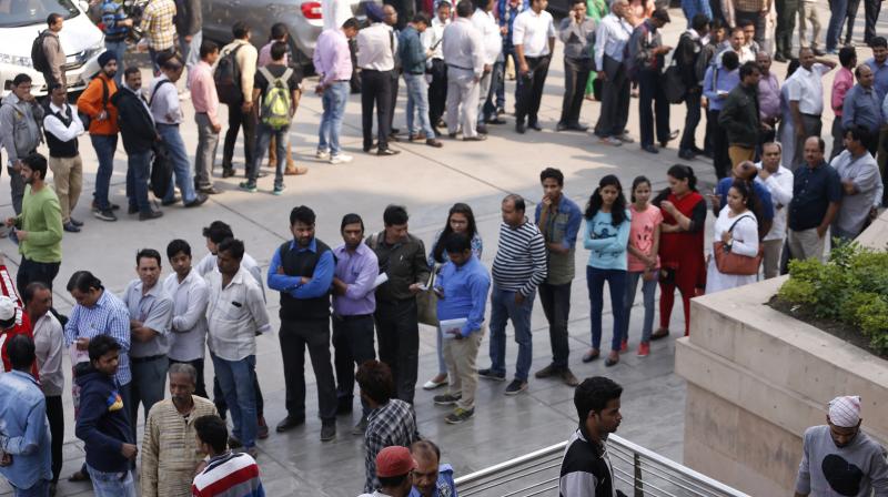 Demonetisation: On first payday, long queues as ATMs, banks run