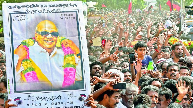 Supporters, in large numbers, arrive to pay their last respects to DMK chief M. Karunanidhi at Rajaji Hall in Chennai on Wednesday. (Photo: AP)
