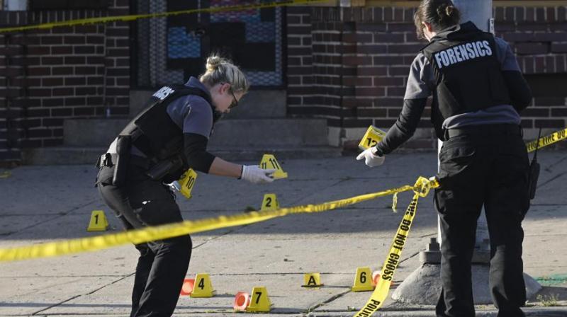 One dead, seven injured as gunman opens fire at crowd in Baltimore