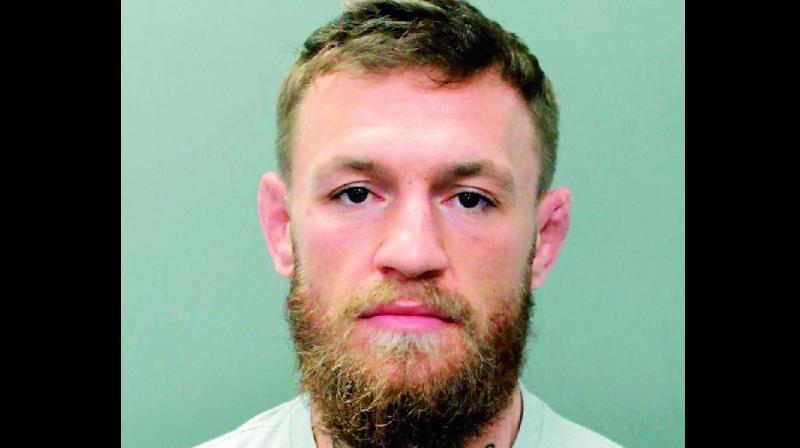 McGregor is arrested for â€˜theftâ€™ of fanâ€™s cellphone