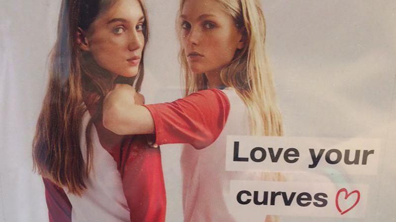 A photo of the Love your Curves poster was snapped by a Twitter user from Ireland who found it while shopping at the popular retailer. (Photo: Twitter)