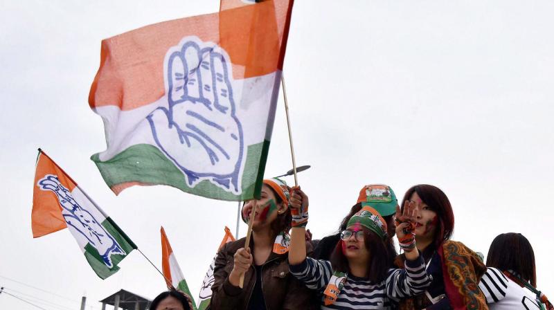 Supporters of Congress celebrate their candidate win Assembly elections in Imphal. (Photo: PTI)