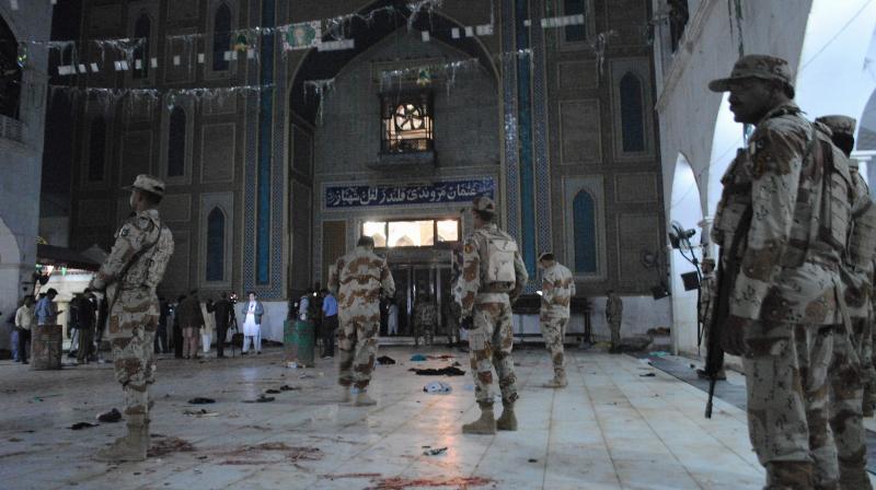 Pakistani para-military soldiers stand alert after a deadly suicide attack at the shrine of famous Sufi Lal Shahbaz Qalandar in Sehwan. (Photo: AP)