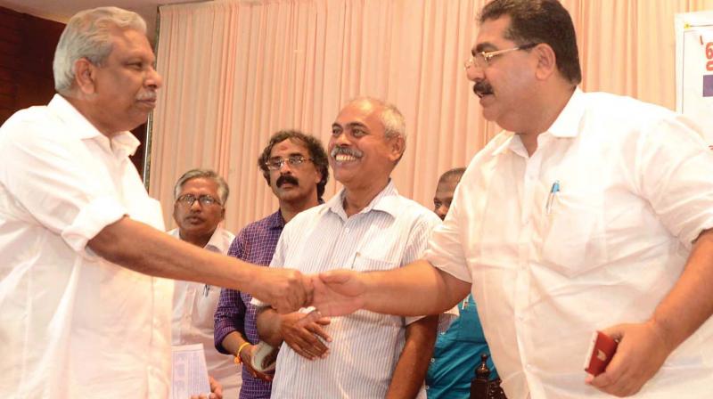 A. C. Moideen, Minister for Local Self Government, greets GCDA chairman V. Saleem during the inauguration a  seminar on waste management, organised by the district administration and Ernakulam District Resident Association Apex Council in Kochi on Friday.	DC