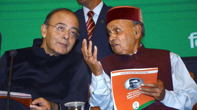 Union Finance Minister Arun Jaitley with former chief minister Prem Kumar Dhumal during launch of BJP Golden Vision document for the Assembly elections, in Shimla on Sunday.  (Photo: PTI)