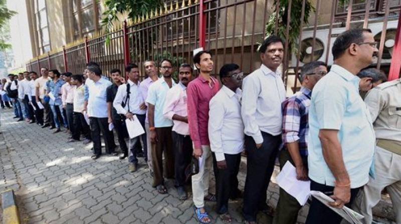 As banks reopen, people line up in long queues across the country  As banks  reopen, people line up in long queues across the country