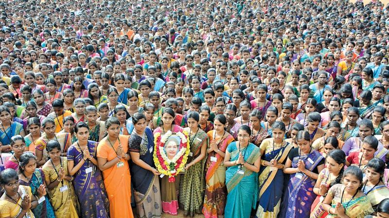 Students of Valliammal College for women in Anna Nagar pay tributes to the late Chief Minister J. Jayalalithaa on Friday. (Photo: DC)