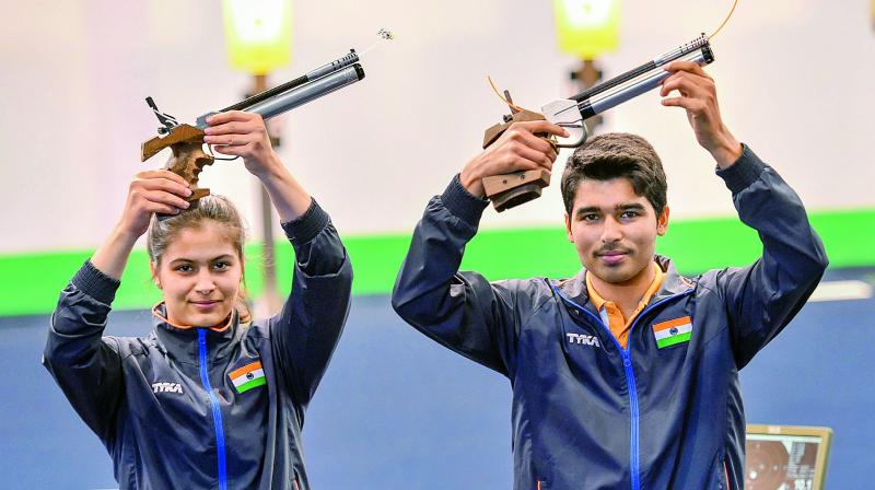 Manu Bhaker and Saurabh Chaudhary pose after winning gold in the 10m Air Pistol Mixed Team event during the ISSF World Cup Rifle/Pistol in New Delhi on Wednesday. (Photo: PTI)