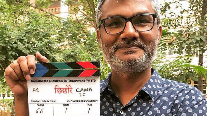 Nitesh Tiwari poses with clapperboard for Chhichhore.