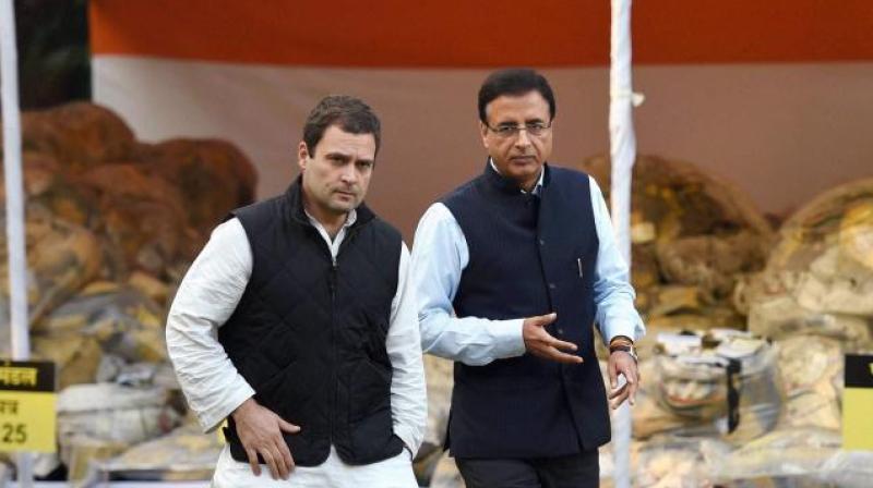 Criminal defamation suits were filed before a local court on Monday against Congresss leaders Rahul Gandhi and Randeep Singh Surjewala by the Ahmedabad District Cooperative Bank. (Photo: PTI)