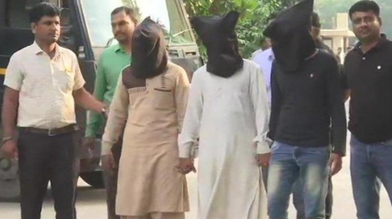 According to CCTV footage, two men and a woman were seen going towards Tiwaris residence. (Photo: ANI)