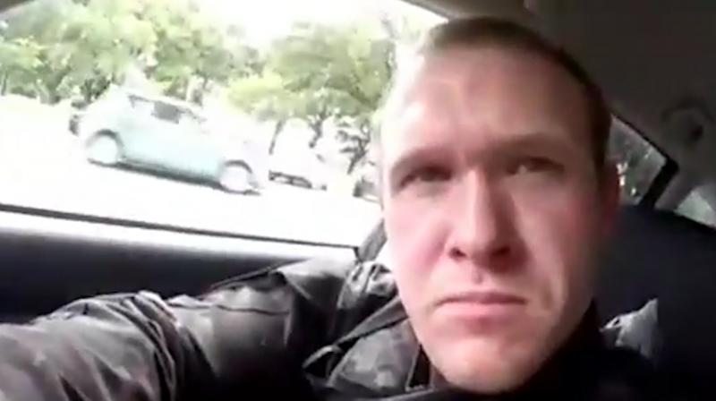 This image taken from the shooters video, which was filmed Friday, March 15, 2019, shows him as he drives and he looks over to three guns on the passenger side of his vehicle in New Zealand. (Photo: AP)