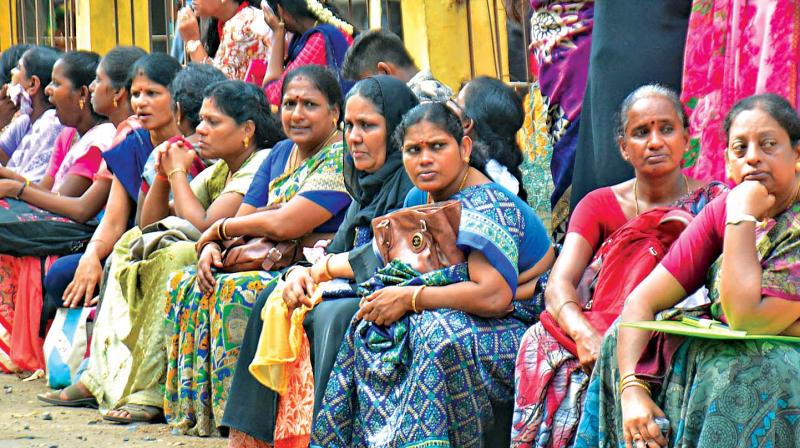 Anxious parents wait outside an examination centre at Chennai. (Photo: DC)