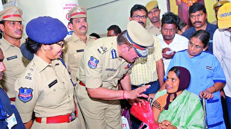 Police commissioner Anjani Kumar and senior police officials visit the mother of the rescued baby at Koti maternity hospital on Wednesday. 	(Image: DC)
