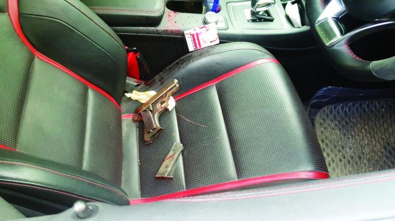 A country-made pistol and a magazine found in the car in which Faizan Ahmed, owner of a job consultancy firm, reportedly shot himself.