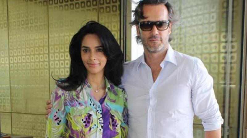 Mallika Sherawat and her French partner Cyrille Auxenfans.