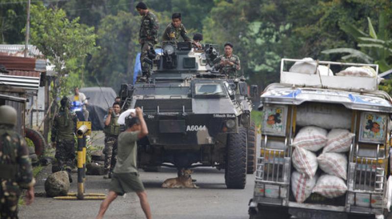 Soldiers prepare for deployment on the outskirts of Marawi city, southern Philippines. The Philippine military says 13 marines have been killed in fierce fighting with Muslim militants who have laid siege to southern Marawi city. (Photo: AP)