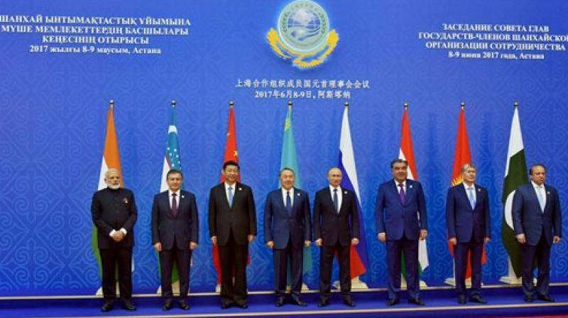 Prime Minister Narendra Modi with the President of Kazakhstan, Nursultan Nazarbayev (4th L), Chinese President Xi Jinping (3rd L), Russian President Vladimir Putin (4th R), Pakistans Prime Minister Nawaz Sharif (Extreme Right) and other Heads of Delegations after inclusion of new Member States, at the Shanghai Cooperation Organisation (SCO) Summit, in Astana, Kazakhstan on Friday. (Photo: AP)