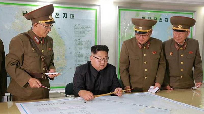 North Korean leader Kim Jong-Un (C) ast week delayed the Guam strike plan, but warned it could go ahead depending on Washingtons next move. (Photo: AFP)