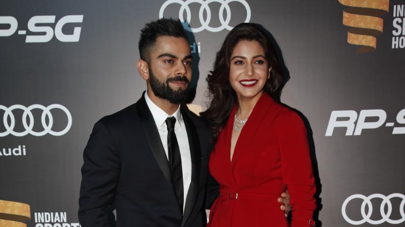 Virat Kohli looked dapper in a navy-blue suit, while the actress donned a rose-red pantsuit. Anushka styled her attire with a thin diamond necklace on her neck. (Photo: Deccan Chronicle)