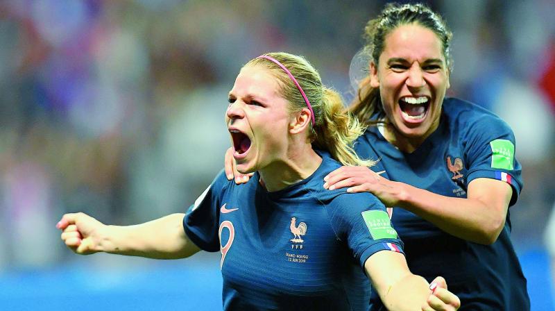 Frances forward Eugenie Le Sommer (left) celebrates after scoring a goal during the Womens World Cup Group A football match against Norway at the Nice Stadium in Nice on Thursday. (Photo: AFP)