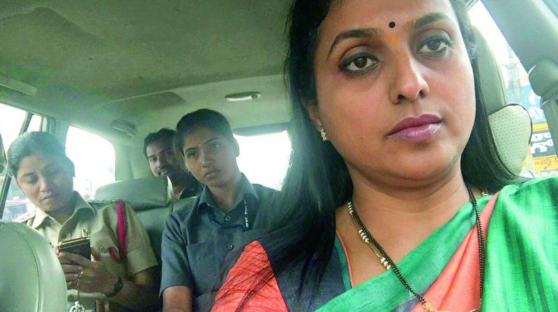 Circle Inspector Sahera Begum in the back seat (left) takes YSR congress MLA R.K. Roja to Vijayawada airport near Gannavaram on Saturday.