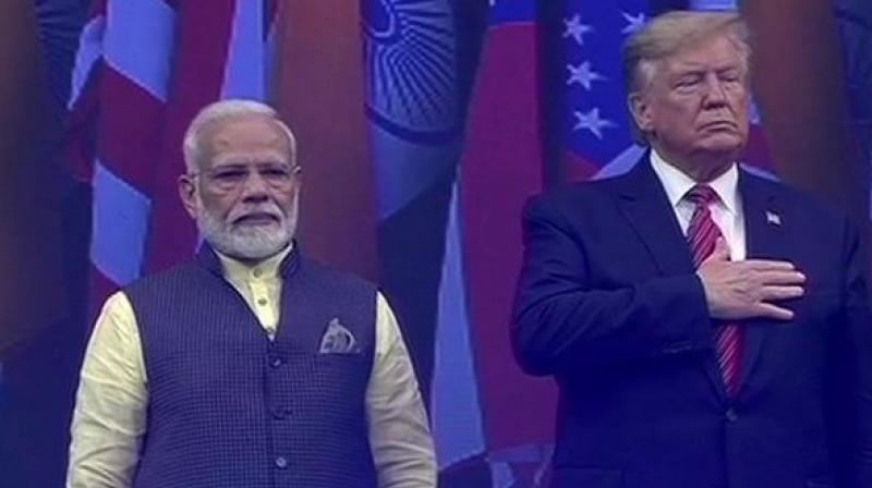 US President Donald Trump and Prime Minister Narendra Modi on stage at NRG stadium in Houston. (Photo: ANI)