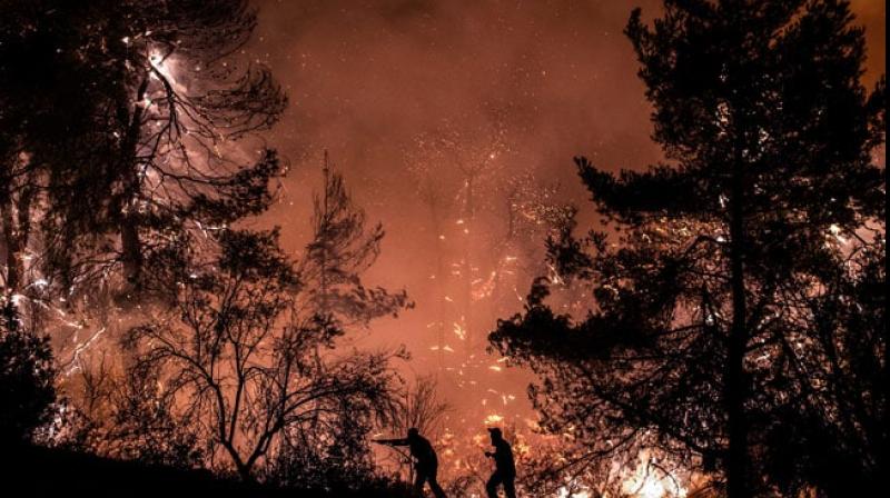 Massive wildfire on Greek island, several villages evacuated