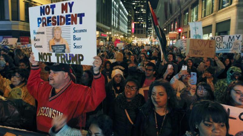 Demonstrators in both red and blue states hit the streets for another day Thursday to express their outrage over Donald Trumps unexpected win. (Photo: AP)