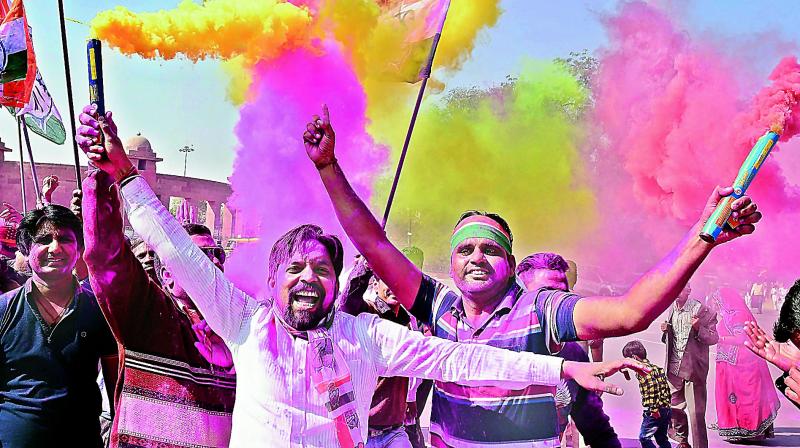 Congress workers celebrate the partys win in Mandalgarh Assembly seat in Bikaner on Thursday. (Photo: PTI)