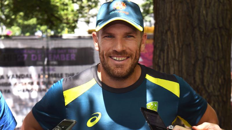 Australia opening batsman Aaron Finch has declared himself fit for the Boxing Day Test against India in Melbourne and said his injured finger would need to be cut off to prevent him from playing in front of his home states fans. (Photo: AFP)