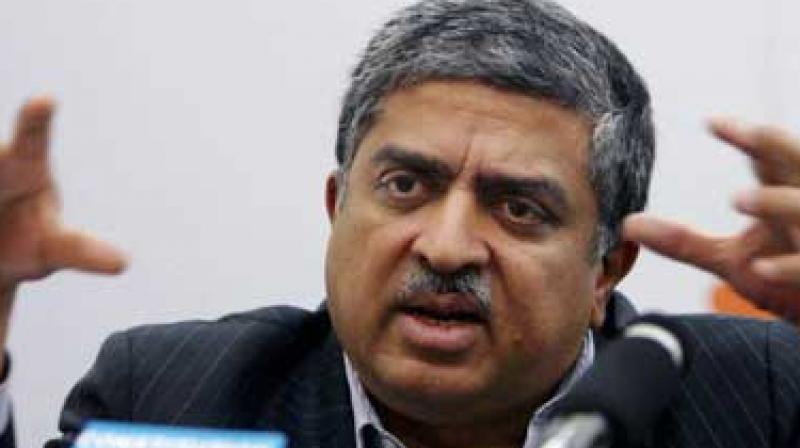 Nandan Nilekani is one of the seven founders of Infosys and called Indias UID man as he spearheded the launch of Aadhaar project. He is all set to take back control of Rs 64,000 crore or $10 billion company at a time when rift between the founders and the management has come into public. (Photo: PTI)